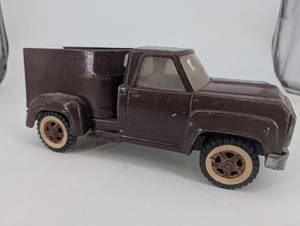 lot 70 image: Ford Brown Die-Cast Toy Truck with Dump Bed - Vintage Pickup