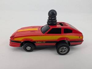 lot 74 image: Five Winders Turbo ZX Die-Cast Car - Red with Yellow Stripe