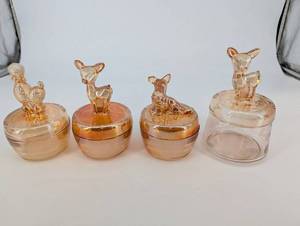 lot 131 image: Glass Jars with Animal-Topped Lids (Lot of 4)
