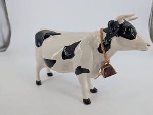 lot 135 image: Ceramic Cow Figurine with Rope Bell Necklace - Black & White Spotted, About 9in Long