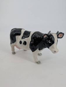 lot 139 image: Holstein Cow Ceramic Figurine - Black & White Glazed Farm Animal
