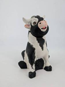 lot 140 image: Black & White Ceramic Cow Figurine - 9-Inch Farm Animal Sculpture