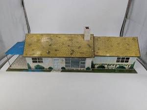 lot 157 image: Vintage Tin Litho Dollhouse with Yellow Roof and Blue Side Canopy