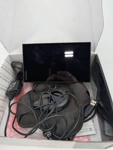 lot 228 image: Garmin DriveSmart 65 NA MT GPS Navigator with Car Mount & USB Cable