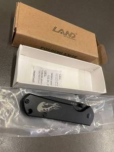 lot 94 image: LAND Tactical Knives Folding Knife - Black Blade, Flame Logo Handle