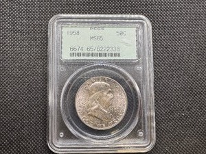lot 42 image: 1958 PCGS MS65 Silver Franklin Half Dollar