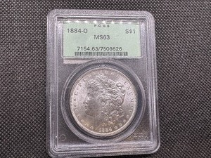 lot 2 image: 1884 O PCGS MS 63 Morgan Silver Dollar