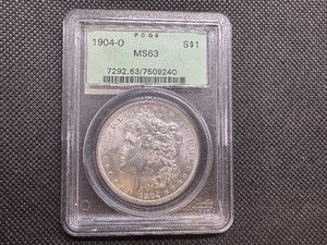 lot 8 image: 1904 O PCGS MS63 Morgan Silver Dollar