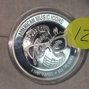lot 12 image: 2 oz t Buddy Holly, .999 Silver Icon Round