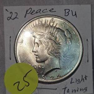 lot 25 image: 2022 Peace Dollar $1 BU wLight Toning