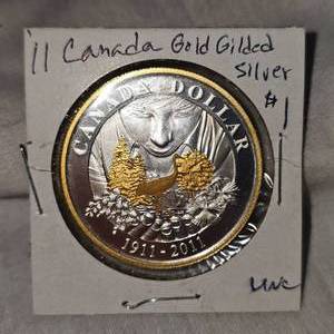 lot 90 image: 2011 Canada Gold Guilded Silver $1 UNC