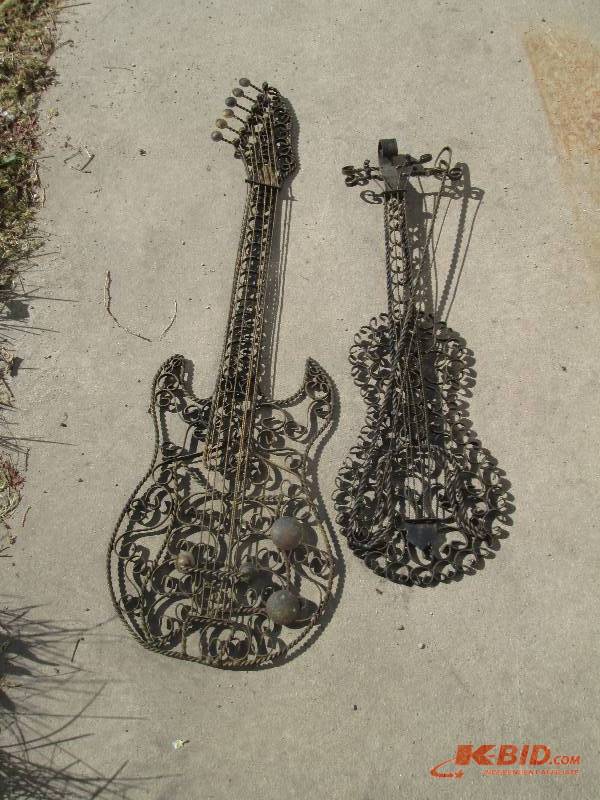 lot 75 image: metal wall hangings of a guitar and...