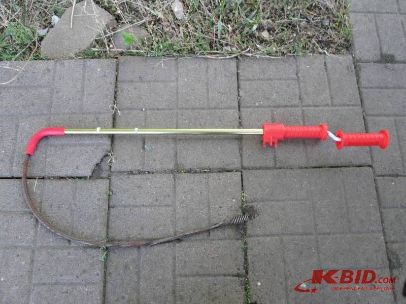lot 82 image: Ridgid brand long drain snake...