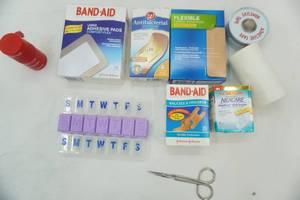 lot 17 image: Bandaids, Pill organizers, adhesive tape