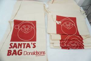 lot 22 image: NEW Canvas Bags 28x 14.5 7 ct. Santas Bag Donaldsons