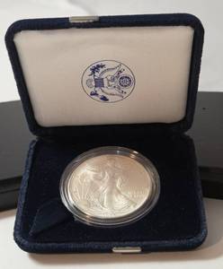 lot 72 image: 1986 Silver American Eagle - One Ounce Proof Silver Bullion Coin - First Year of Issue - Blue Velvet Box