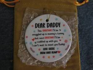 lot 107 image: Baby bump holiday orderment for dad...