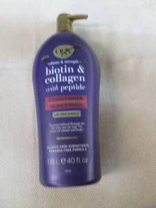 lot 74 image: 40 Oz bottle of OGX biotin & collag...