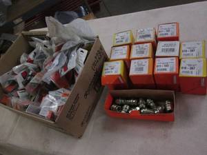 lot 320 image: Box of lug nuts, clips and other au...