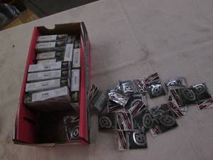 lot 326 image: Spark plugs and emblems...