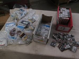 lot 328 image: Car parts, spark plugs and emblems...
