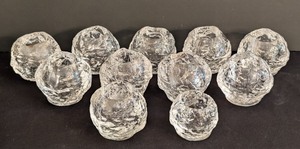 lot 286 image: Kosta Boda Crystal Snowball Votive Holders (Lot of 11)