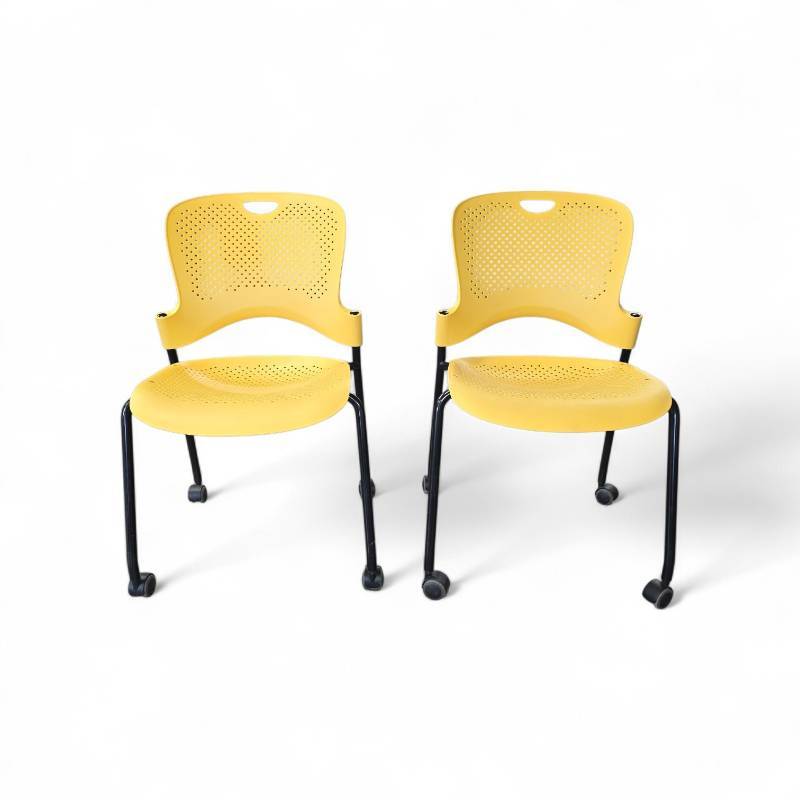 lot 159 image: 2 Herman Miller Caper Chairs On Wheels-Yellow Retail at $320 Each
