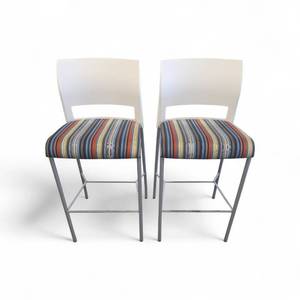 lot 251 image: Steelcase Move bar stools featuring a white plastic back, a striped upholstered seat, and a four-leg metal frame.