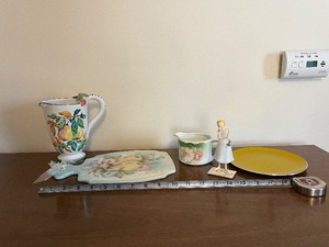 lot 89 image: Fruit Motif Porcelain Pitcher, Plate, Creamer, Figurine & Yellow Charger