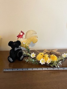 lot 106 image: Black Teddy Bear Plush with Wooden Rooster & Daisy Chick Wreath