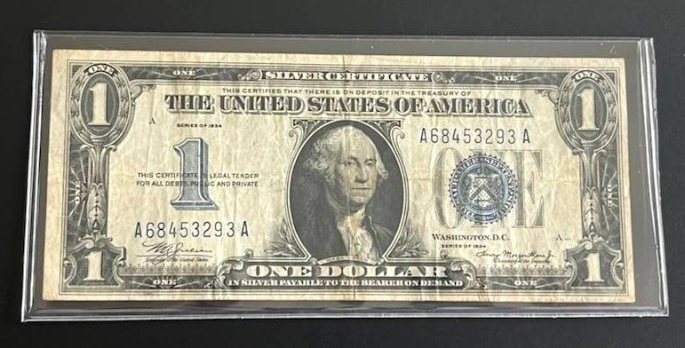 lot 42 image: 1934 $1 Blue Seal Silver Certificate Funnyback (Fine)