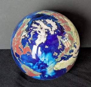 lot 202 image: MB - Lundberg Studios World Map Glass Paperweight (1991)