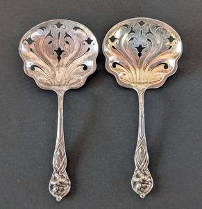 lot 384 image: MB - Pair of Antique Lily by Watson Sterling Silver Pierced Nut  Bon Bon Spoons