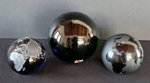 lot 404 image: MB - World Map Glass Paperweights - 3-Piece Set