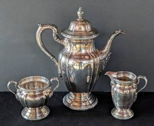 lot 513 image: MB - Vintage Three Piece Reed & Barton De Champlain Silver Plate Tea Set