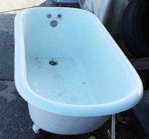 Vintage cast iron clawfoot bathtub, featuring a white porcelain enamel all over. 54 Long X 25.5 Wide X 23 High