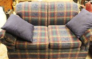 Plaid loveseat upholstered in navy, red, and green fabric. Approx. 57 Inch Long