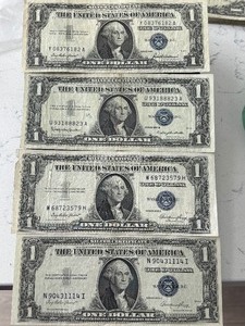 lot 26 image: 1935 and 1957 Blue Seal $1 Dollar Silver Certificates
