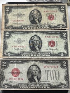 lot 27 image: 1928 and 1953 Red Seal $2 Dollar Notes