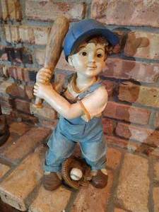 Statue of Boy Playing Baseball