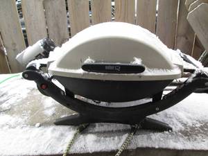 lot 9 image: Weber portable gas grill...