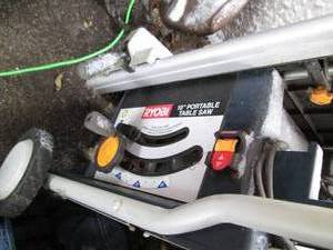 lot 11 image: Ryobi 10 Portable table saw...