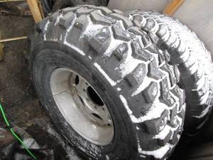 lot 14 image: Newer Interco Super Swamper Tire 36...