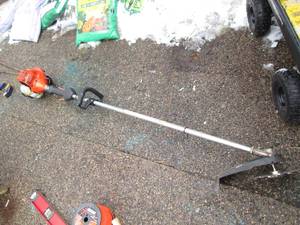 lot 34 image: Echo SRM-225 gas powered weed eater...