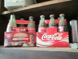 lot 85 image: 2 Packs of Coca Cola bottles, some ...