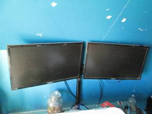 lot 216 image: Pair of Samsung monitors with a sta...