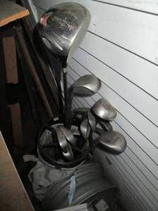 lot 239 image: Set of golf clubs in a case...