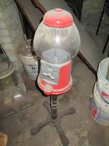 lot 250 image: Antique vending machine on a metal ...