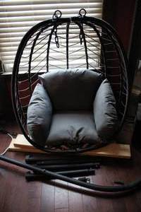 lot 133 image: Wicker style hanging egg-chair with...