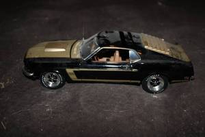 lot 203 image: Black and Gold 1969 Mustang Fastbac...